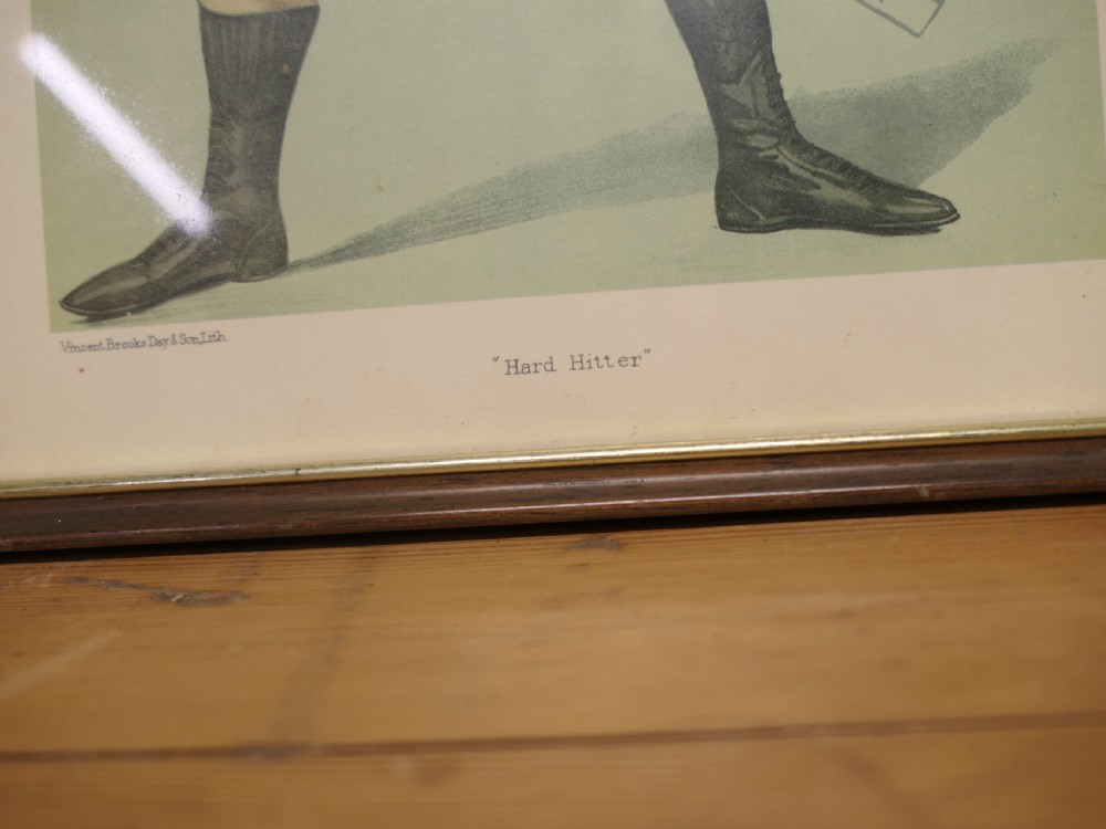 A collection of three framed antique Vanity Fair chromolithograph prints depicting a cricketer, a boxer, and a tennis player. View VI