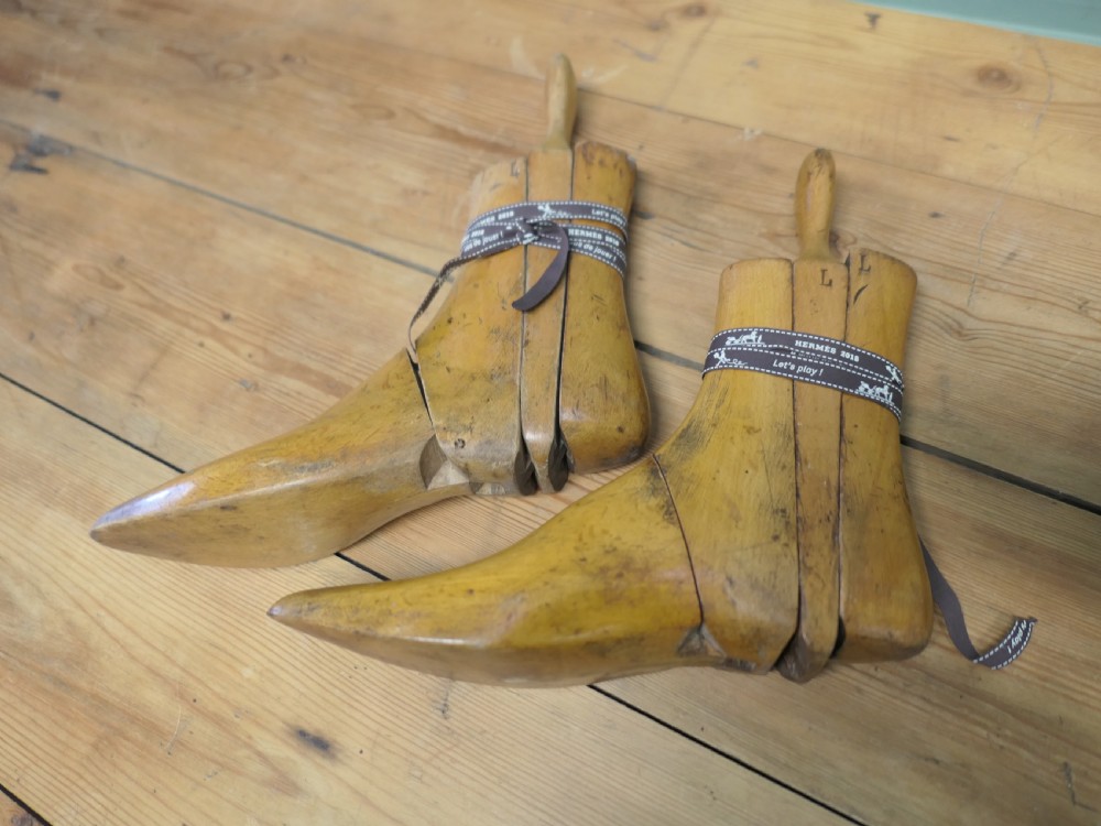 A pair of 19th-century carved wooden ladies ankle boot stretchers featuring smooth contoured timber sections and shaped top handles. View VII