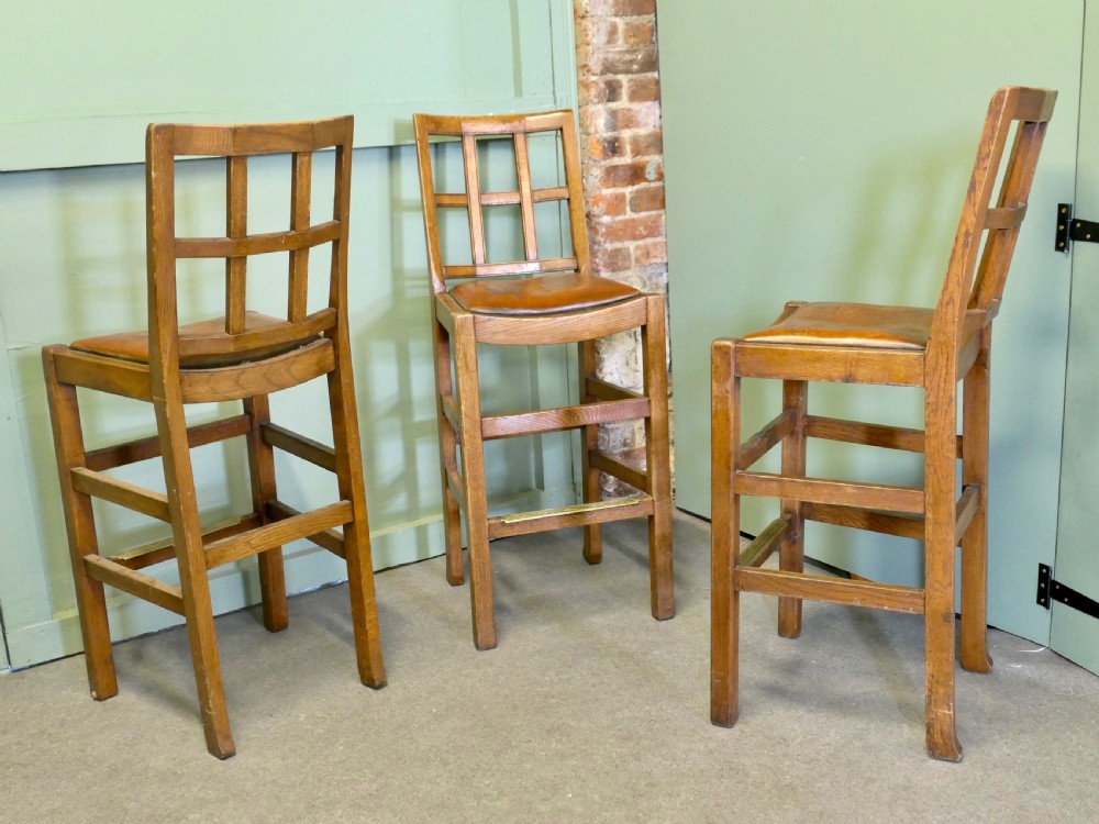A Good Trio of Arts and Crafts High Bar Stools, in Leather and Golden Oak View VI