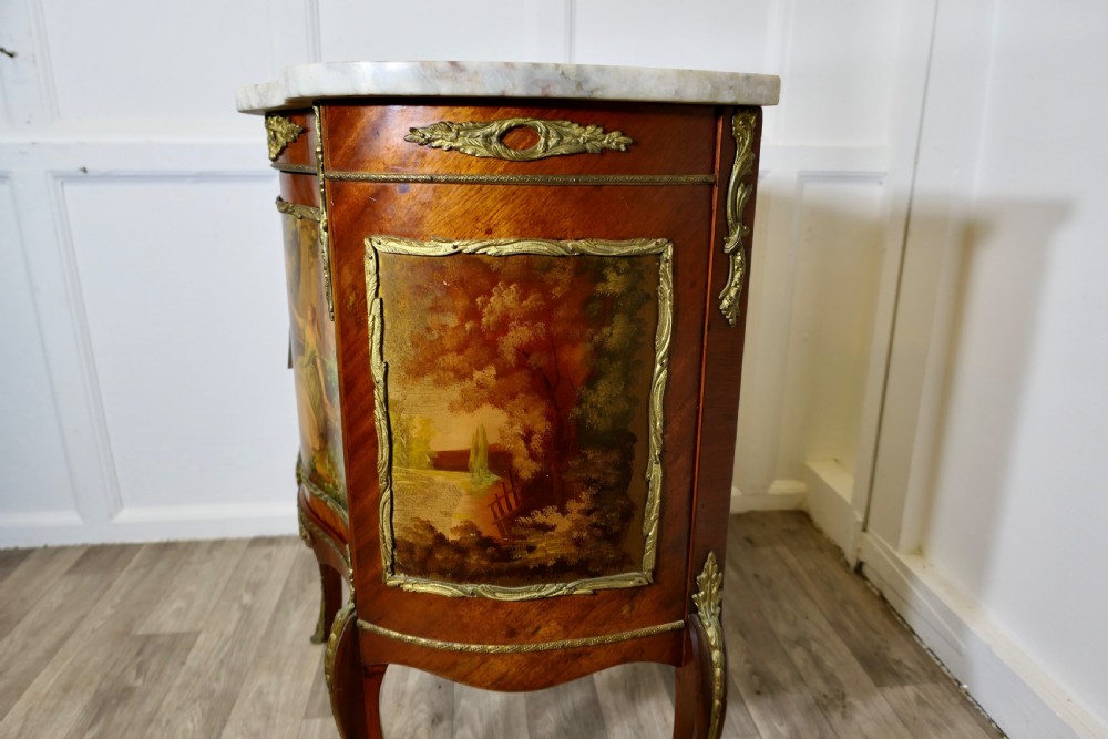 A 19th-century French Vernis Martin side cabinet featuring a curved front, marble top, hand-painted pastoral scene panel, and ornate gilt bronze mounts on cabriole legs. View V