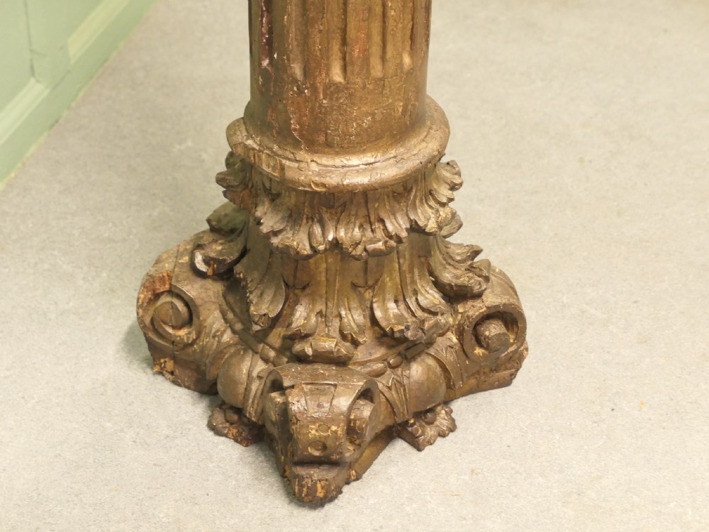 A tall, carved giltwood Corinthian column pedestal featuring a fluted shaft, acanthus leaf capital, and decorative base. View III
