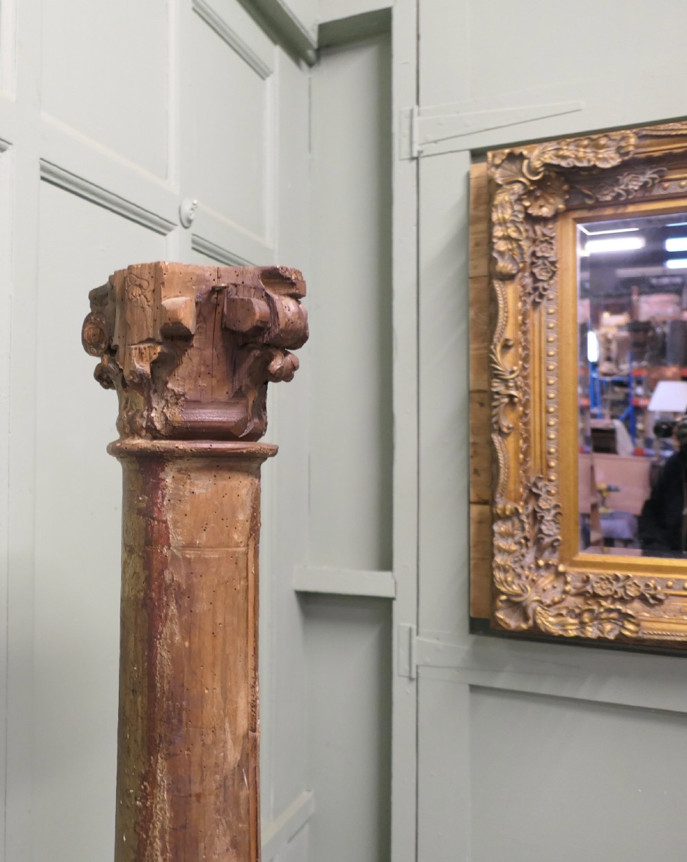 A tall, carved giltwood Corinthian column pedestal featuring a fluted shaft, acanthus leaf capital, and decorative base. View VII