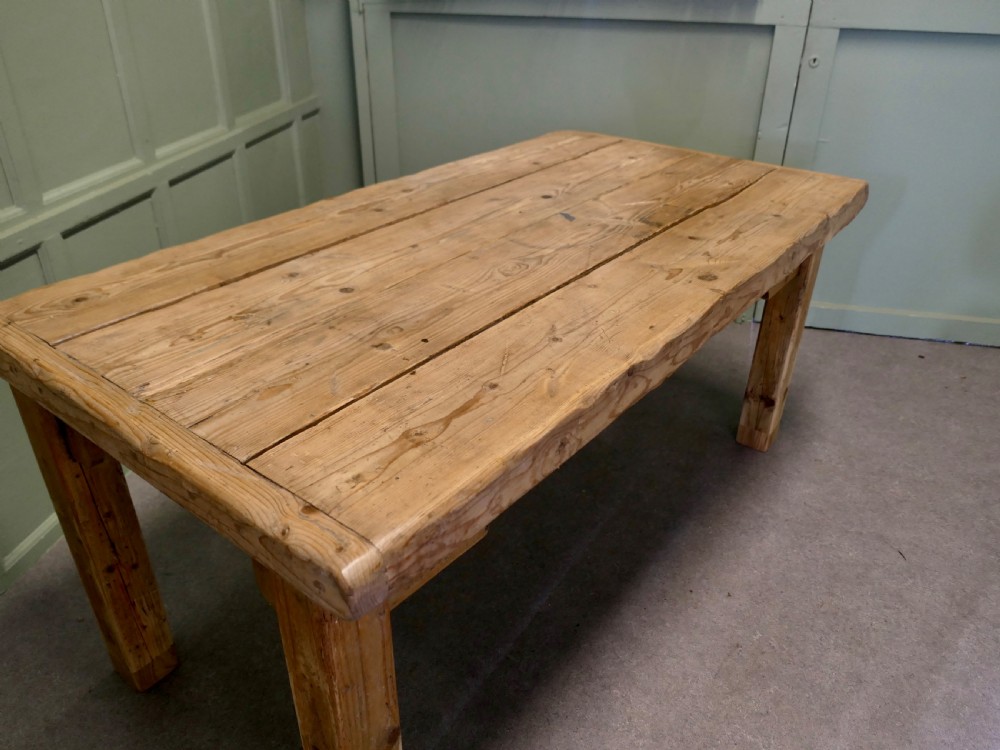 A rustic Victorian scrubbed pine kitchen table featuring a thick plank top and solid square-section legs. View II