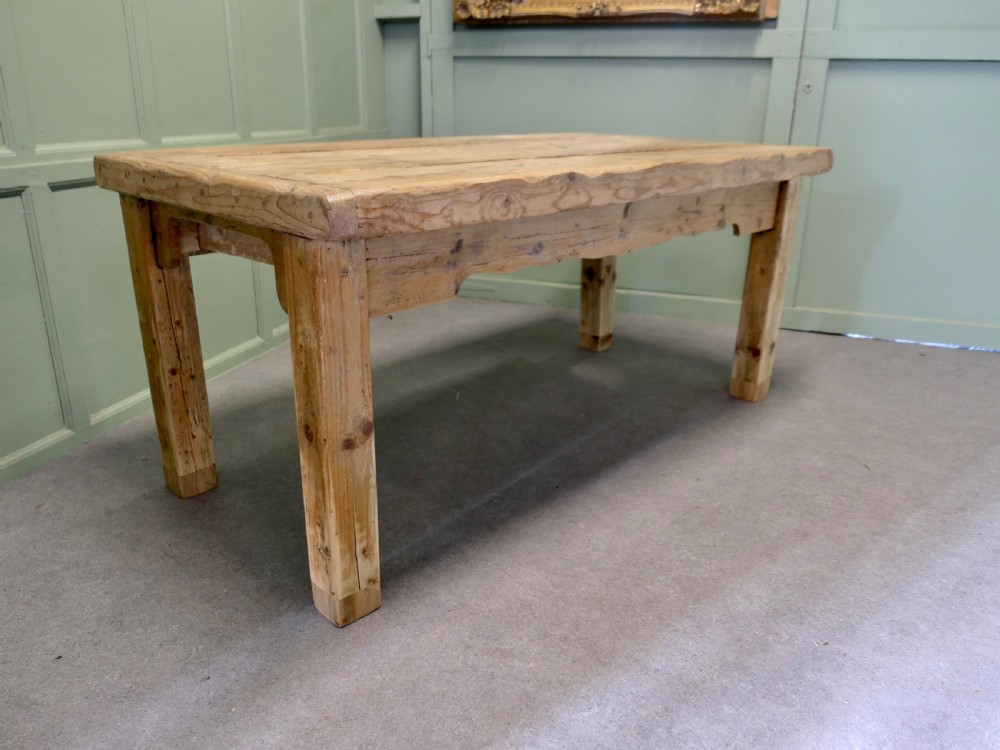 A rustic Victorian scrubbed pine kitchen table featuring a thick plank top and solid square-section legs. View III