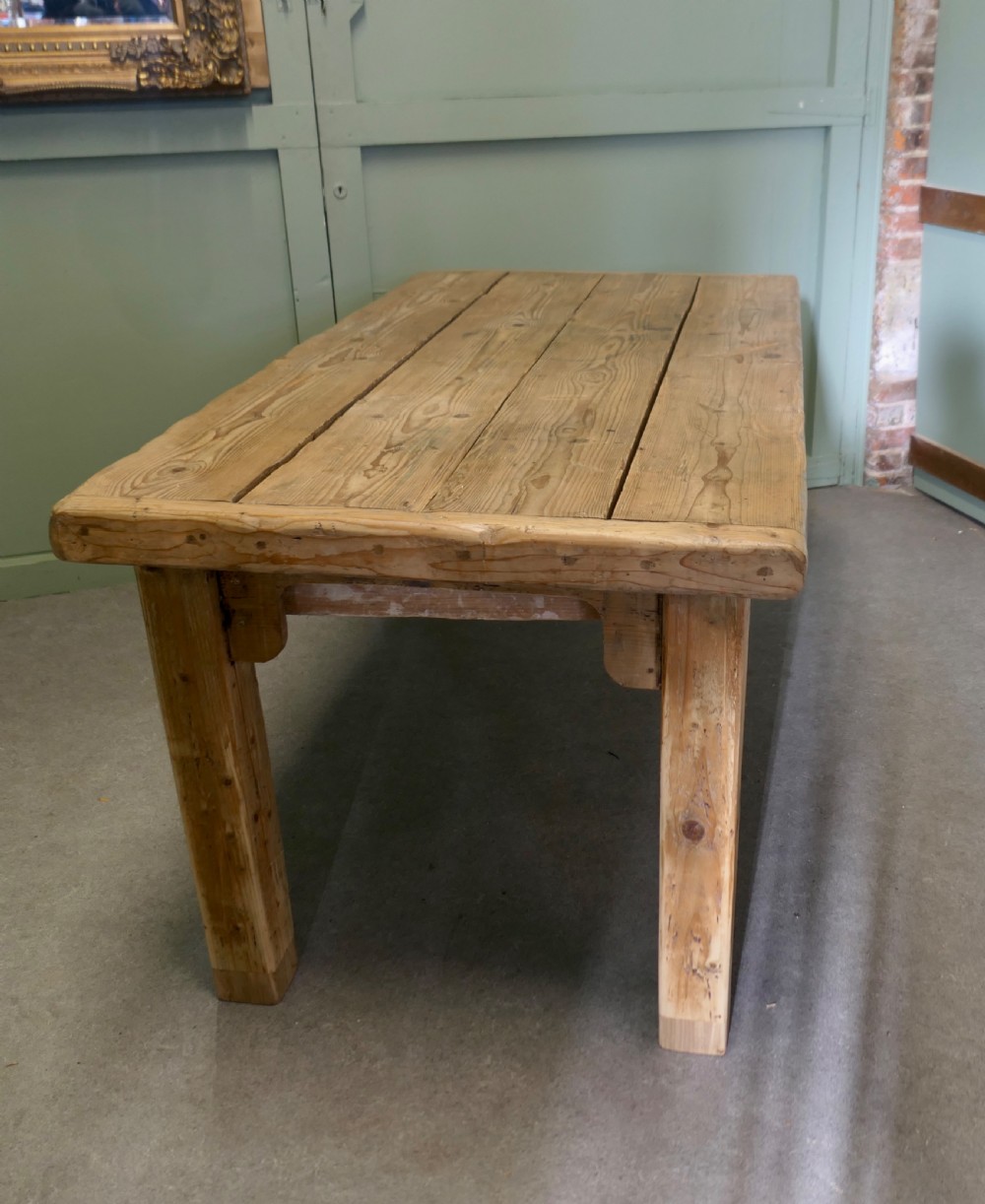 A rustic Victorian scrubbed pine kitchen table featuring a thick plank top and solid square-section legs. View V