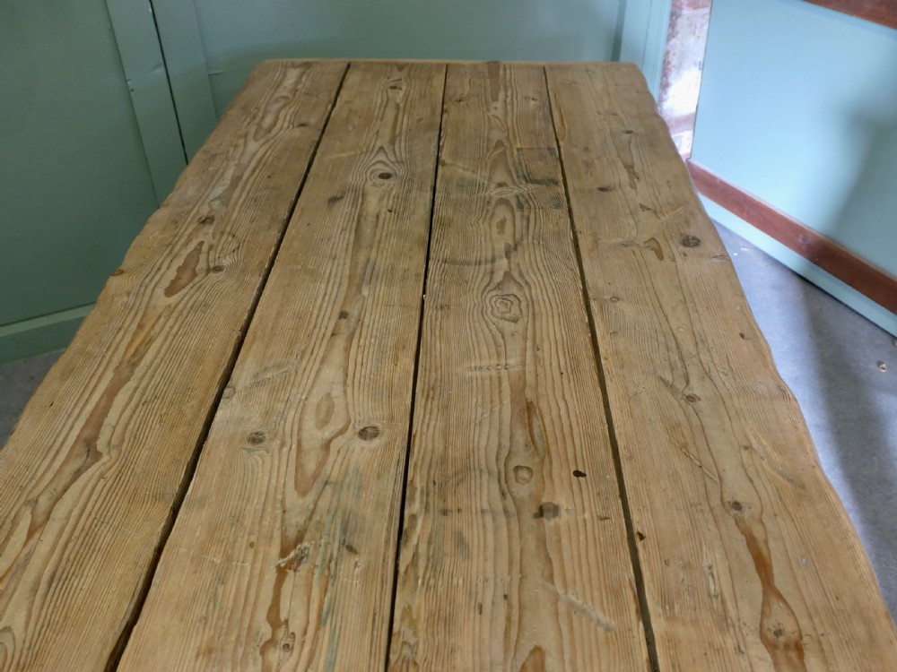 A rustic Victorian scrubbed pine kitchen table featuring a thick plank top and solid square-section legs. View VI