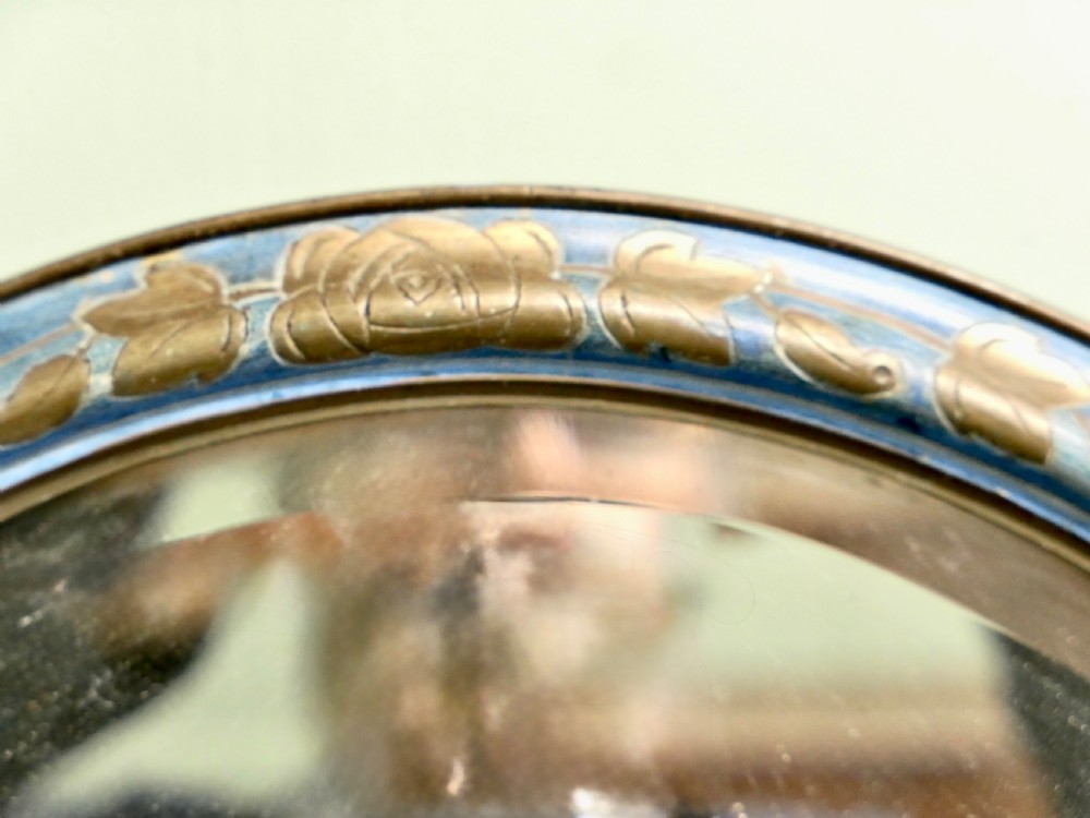 An Art Deco oval wall mirror featuring a pale blue painted frame with carved gilt leaf motifs enclosing an oval glass mirror plate. View III