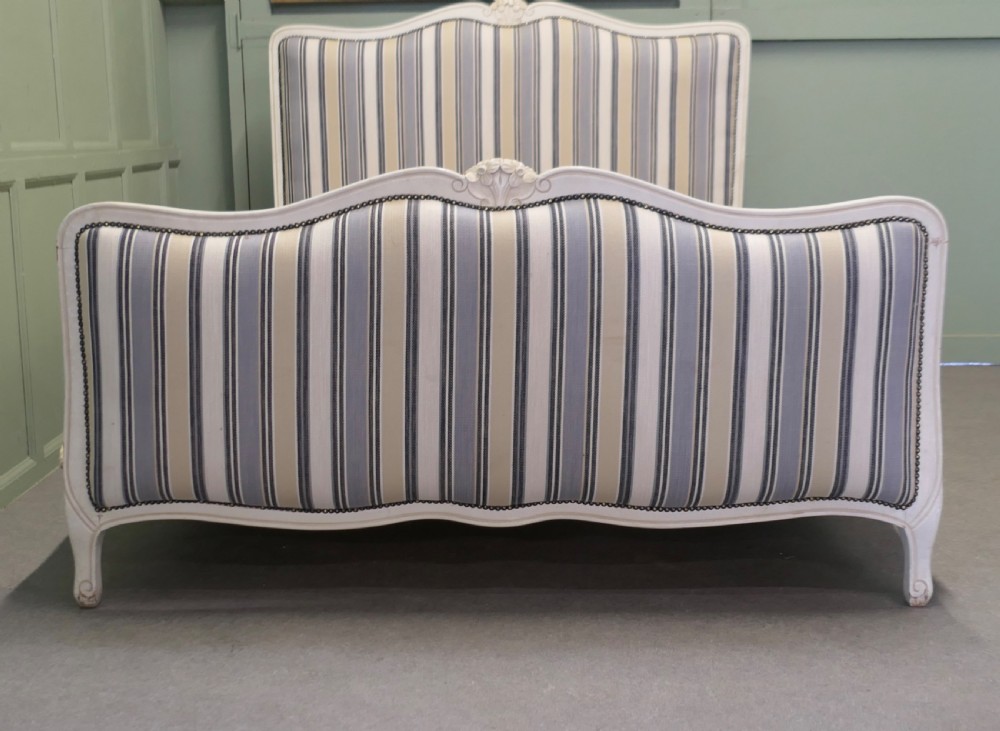 A French Louis XV style double bed featuring a cream painted carved wooden frame and grey striped upholstered headboard and footboard. View II