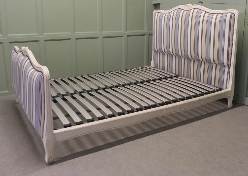 A French Louis XV style double bed featuring a cream painted carved wooden frame and grey striped upholstered headboard and footboard. View IV