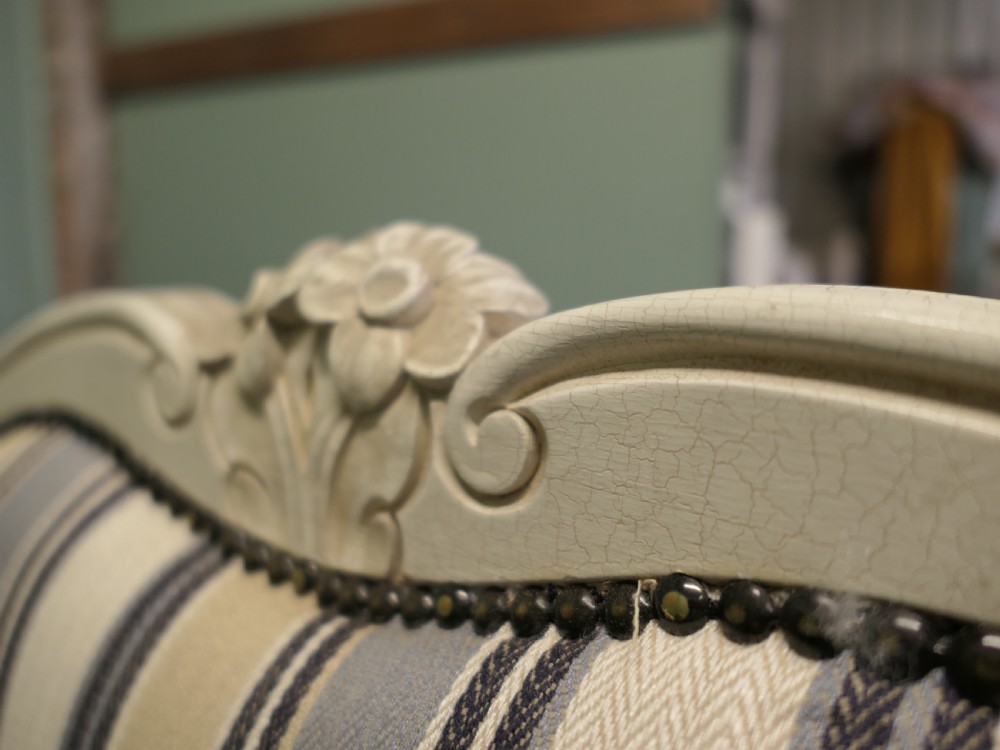 A French Louis XV style double bed featuring a cream painted carved wooden frame and grey striped upholstered headboard and footboard. View VII