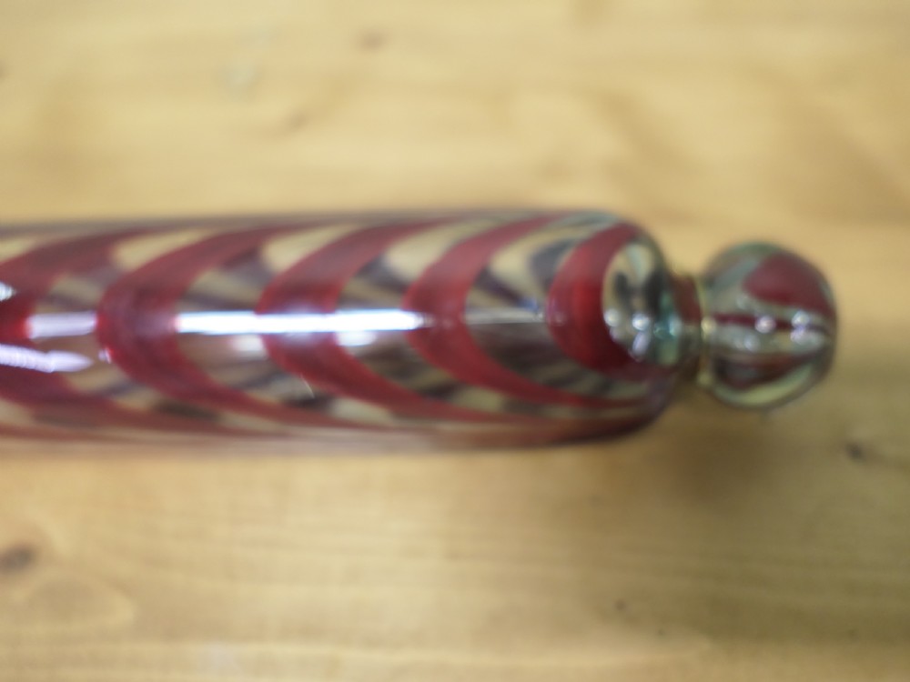 A pair of 19th-century hand-blown glass rolling pins featuring swirled trailing patterns in cobalt blue and ruby red. View IV
