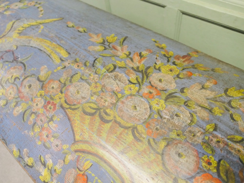 A large blue hand-painted wooden marriage chest decorated with floral motifs, birds, and an openwork scroll-carved base apron. View VII