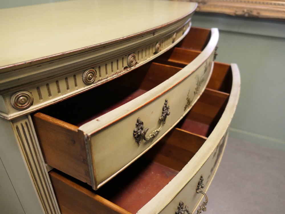 A cream-painted tallboy chest on chest featuring hand-painted Chinoiserie botanical motifs across six drawers with brass bail handles. View II