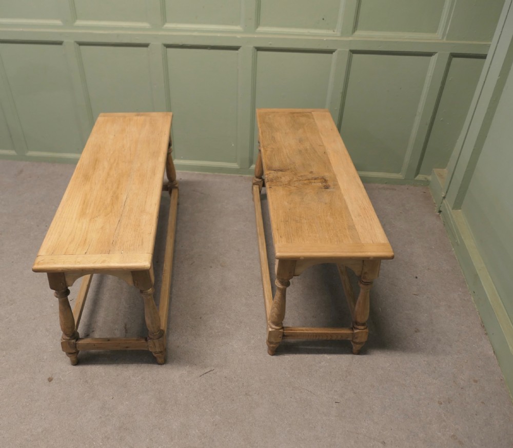 A pair of matching long bleached oak joint benches featuring turned legs, box stretchers, and arched aprons. View IV