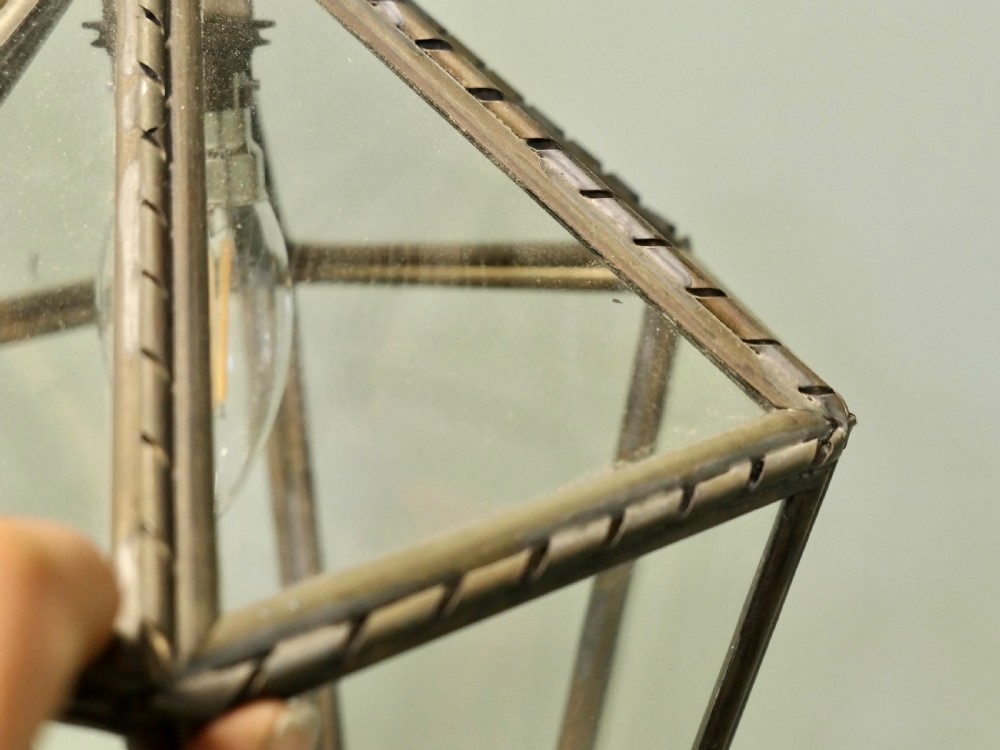 An Arts and Crafts brass hall lantern featuring faceted clear glass panels and a decorative chain hanging loop. View VI