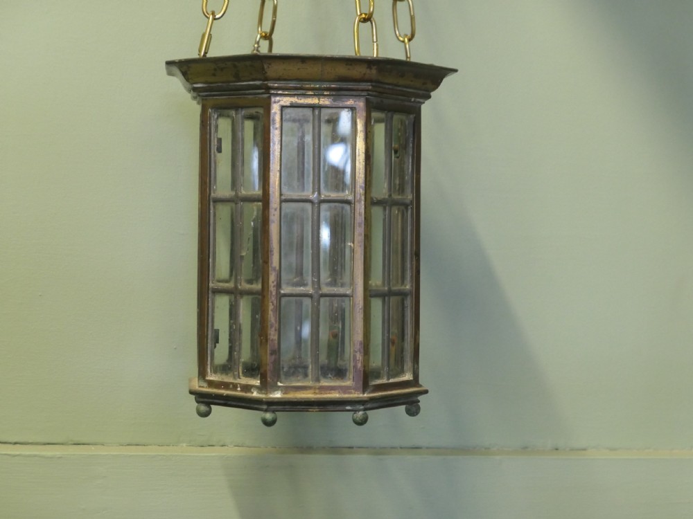 A pair of 19th-century dark bronze hexagonal lanterns with glass panes suspended by brass chains. View VI