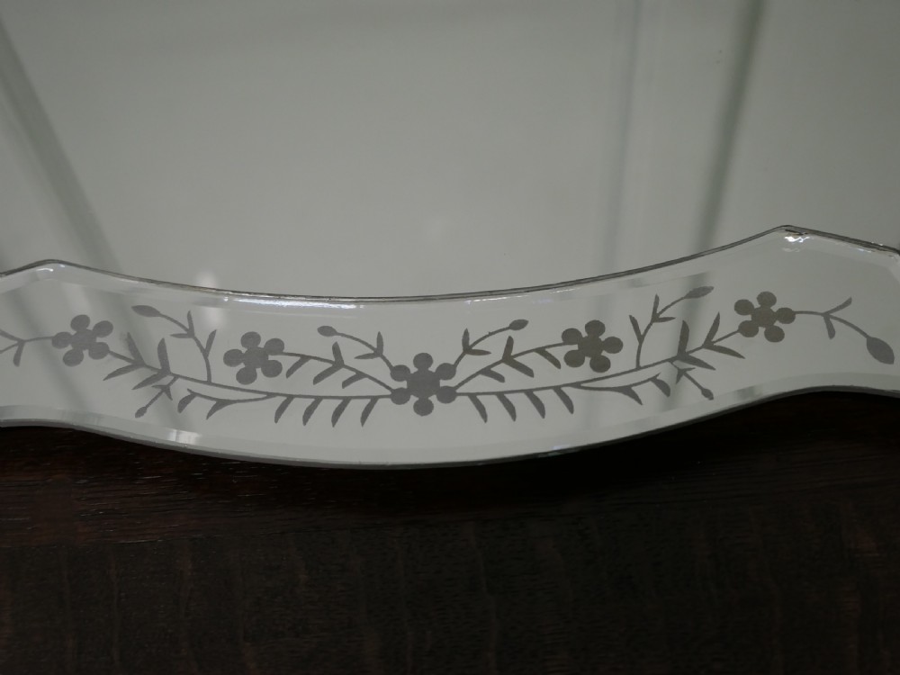 An Art Deco shaped mirrored glass tray featuring etched floral motifs and bevelled cut-glass borders. View II