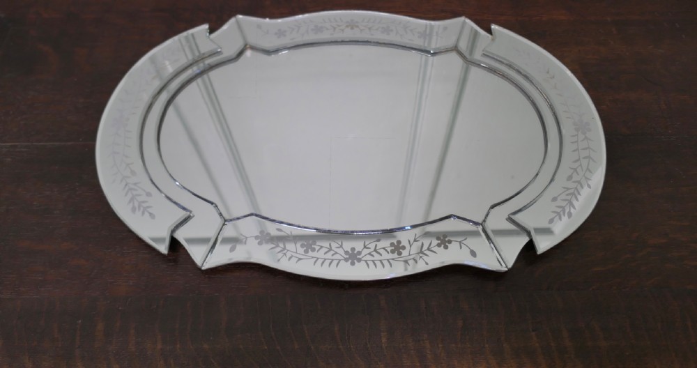 An Art Deco shaped mirrored glass tray featuring etched floral motifs and bevelled cut-glass borders. View III