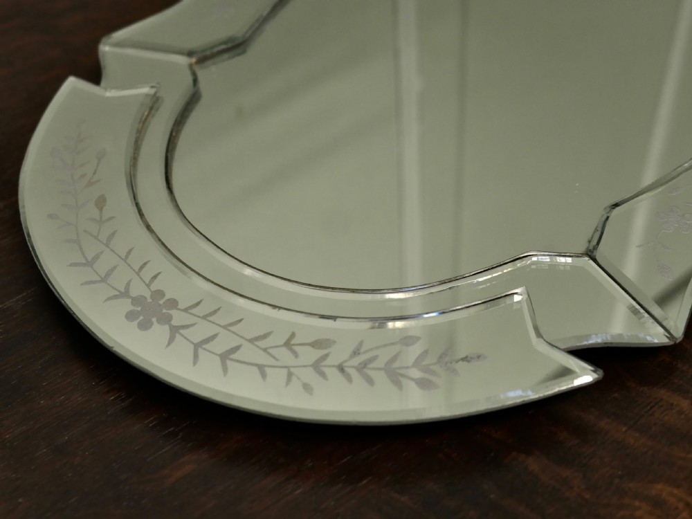 An Art Deco shaped mirrored glass tray featuring etched floral motifs and bevelled cut-glass borders. View VI