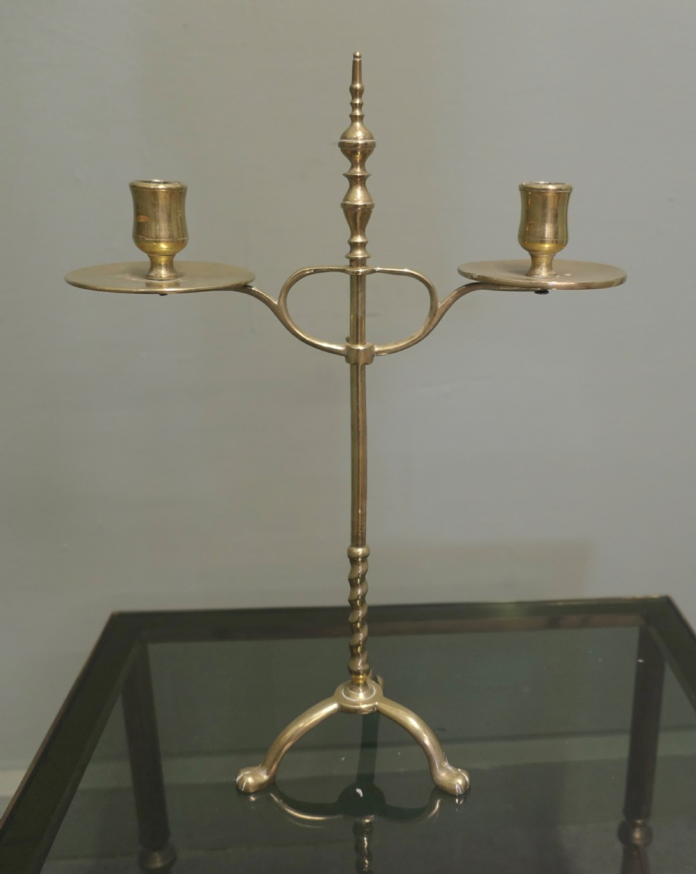 A pair of Arts and Crafts brass student lights featuring adjustable twin candle arms on twisted stems with tripod bases. View II