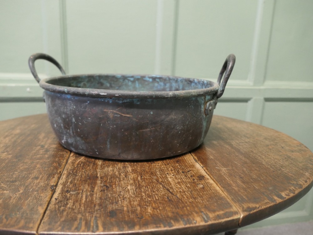 A large 19th-century copper preserving pan featuring twin riveted handles and a patinated finish with hints of verdigris. View II
