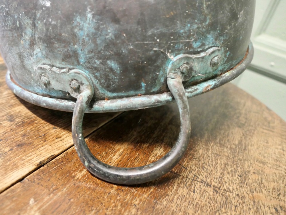 A large 19th-century copper preserving pan featuring twin riveted handles and a patinated finish with hints of verdigris. View V