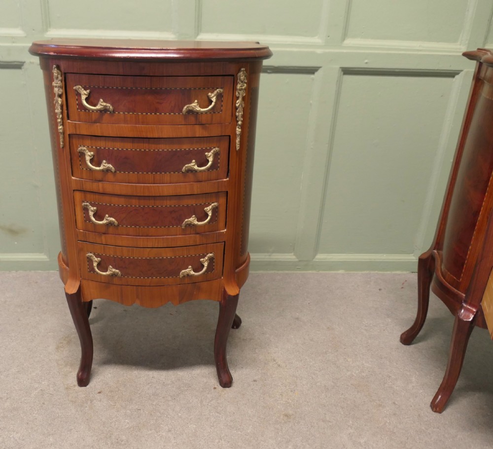 A near pair of French Louis XV style bow-front wooden bedside cabinets with four drawers, brass handles, and cabriole legs. View III