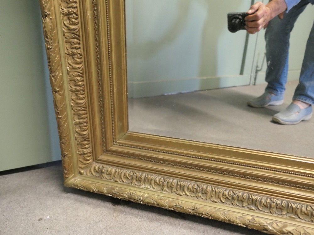 A large nineteenth-century rectangular wall mirror featuring a heavily moulded giltwood frame with classic border detailing. View IV