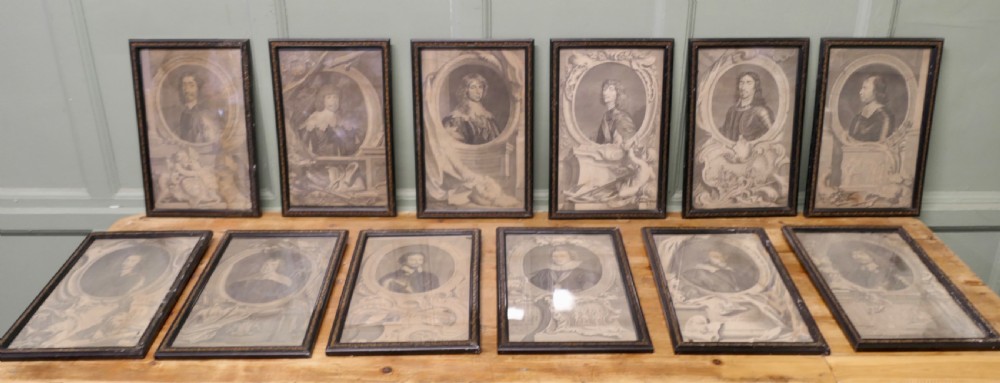 A set of twelve framed monochrome portrait engravings displaying historical figures inside decorative oval borders.