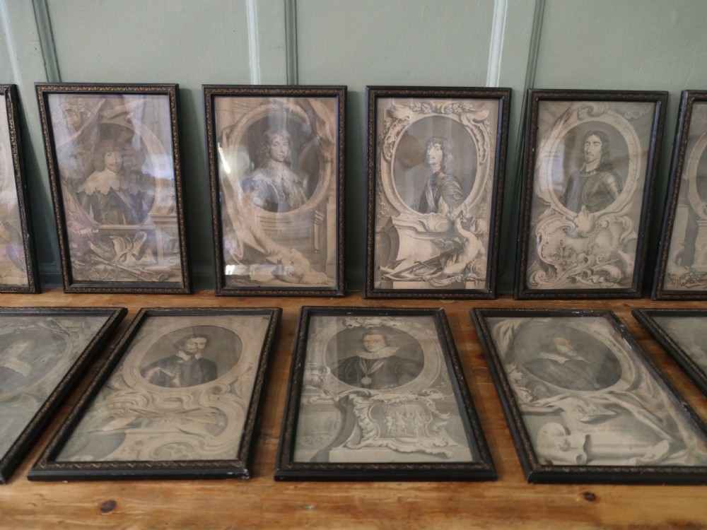 A set of twelve framed monochrome portrait engravings displaying historical figures inside decorative oval borders. View II