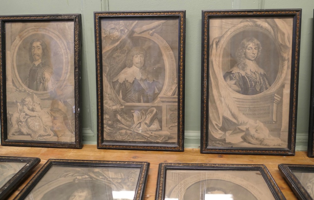 A set of twelve framed monochrome portrait engravings displaying historical figures inside decorative oval borders. View IV