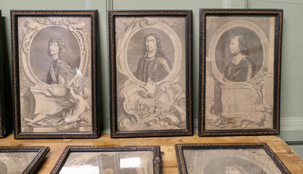 A set of twelve framed monochrome portrait engravings displaying historical figures inside decorative oval borders. View V