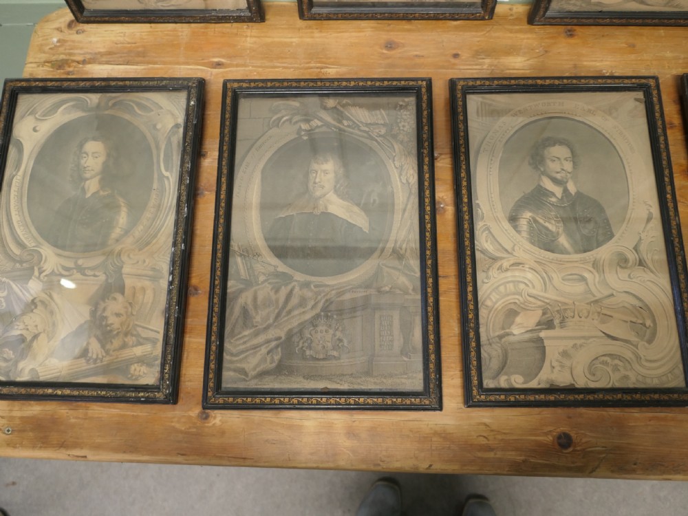 A set of twelve framed monochrome portrait engravings displaying historical figures inside decorative oval borders. View VI