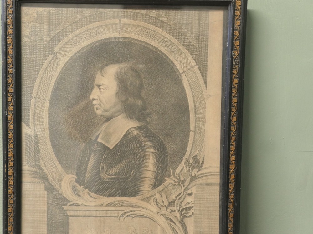 A set of twelve framed monochrome portrait engravings displaying historical figures inside decorative oval borders. View VII