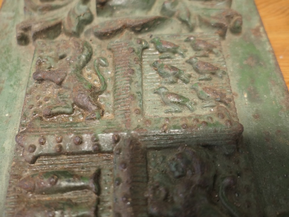 A rectangular cast iron wall plaque featuring the relief-moulded Bournemouth coat of arms with weathered green paint and visible oxidisation. View III