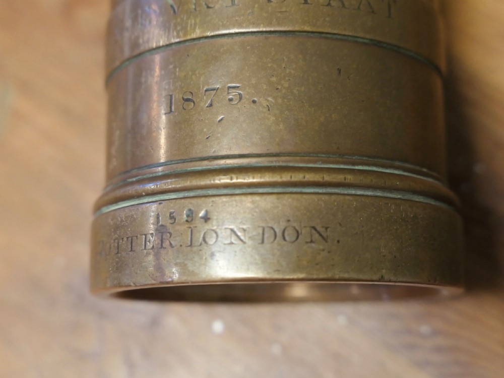 A cylindrical nineteenth-century cast bronze imperial pint measure with engraved lettering and official verification stamps. View III