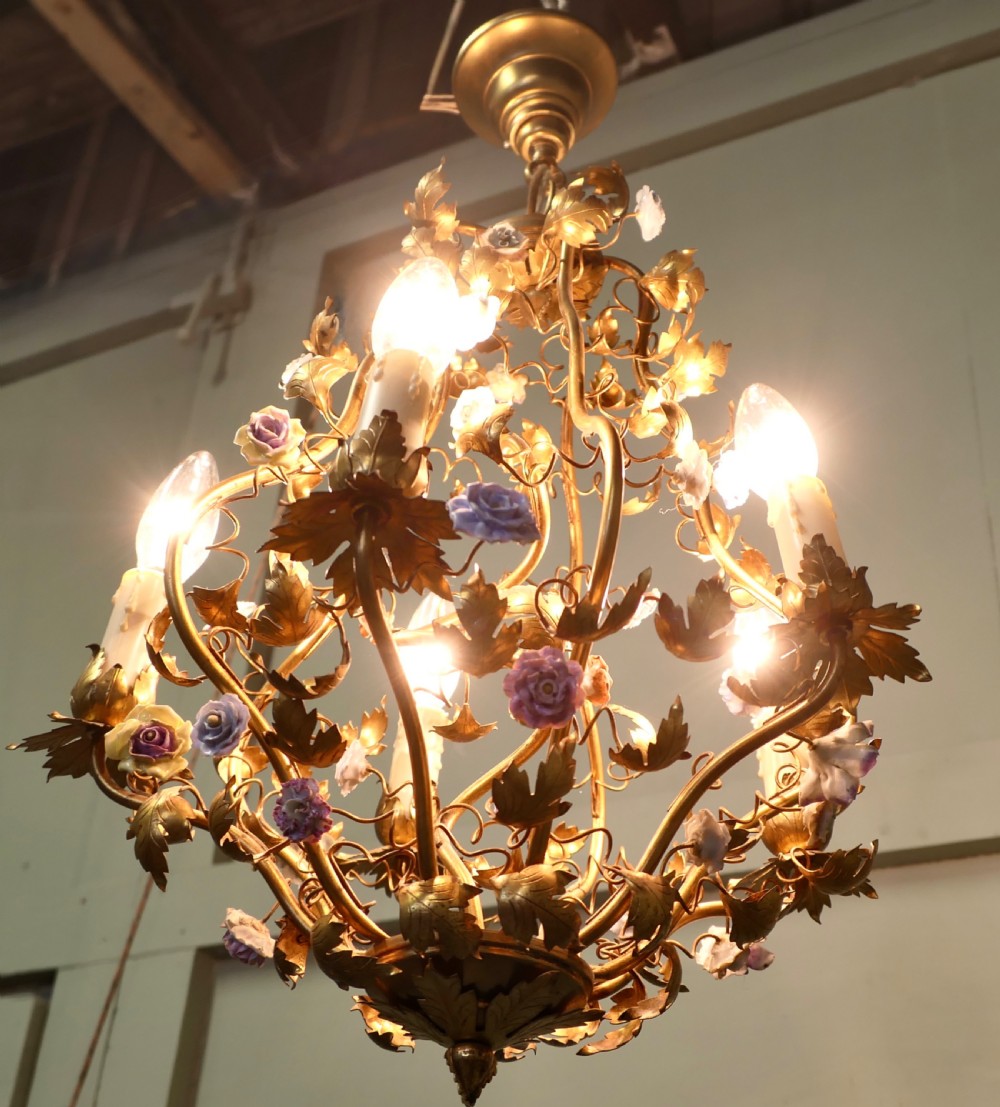 A five-bulb French toleware chandelier featuring a gilded metal frame styled with trailing leaves and multicoloured ceramic flower blooms. View II