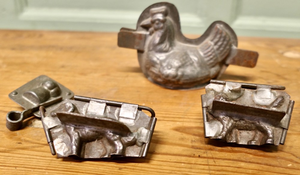Four Early Chocolate Molds, Chicken, Dog, Cat and Toque Blanche 
