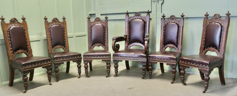 A Set of 6 Gothic Oak High Back Carved Dining Chairs 