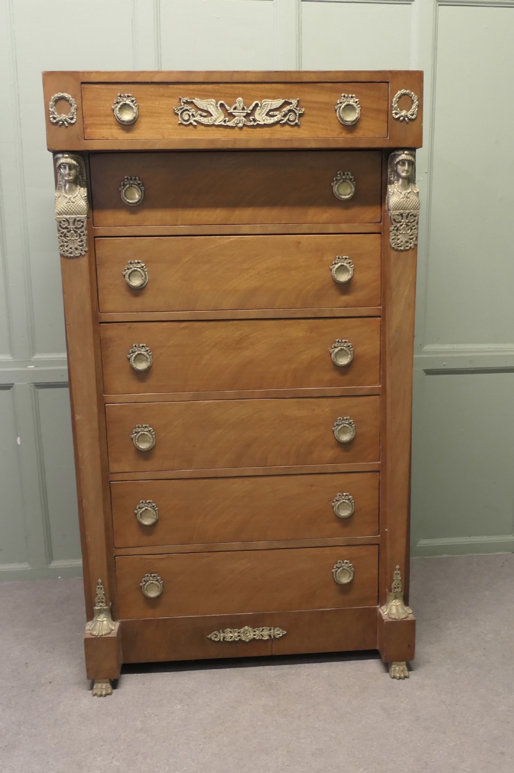 A Tall French Empire Walnut Chest of Drawers in the Neo Classical Style 