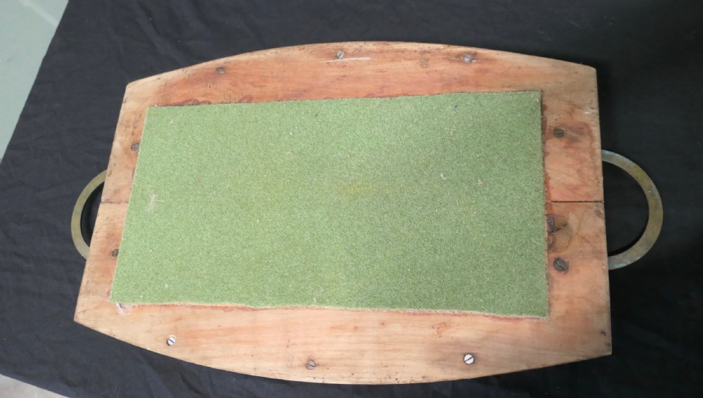 A golden elm wooden serving tray featuring raised side edges and heavy brass ring handles mounted on rectangular wooden blocks. View III