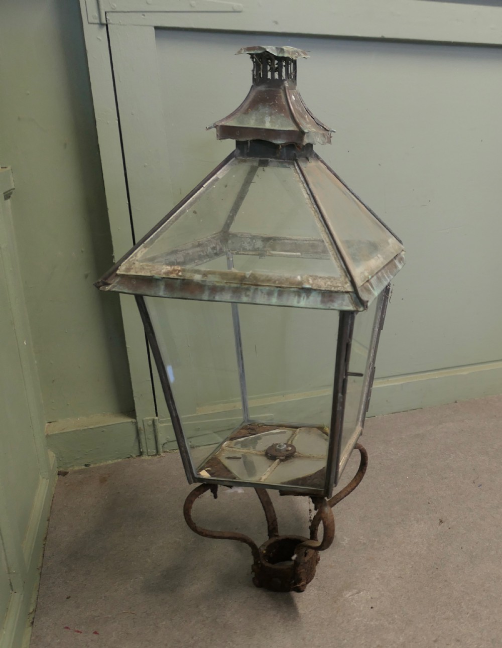 A nineteenth-century copper street lantern featuring glass roof panels, a pagoda chimney cap, and a verdigris patina. View VI
