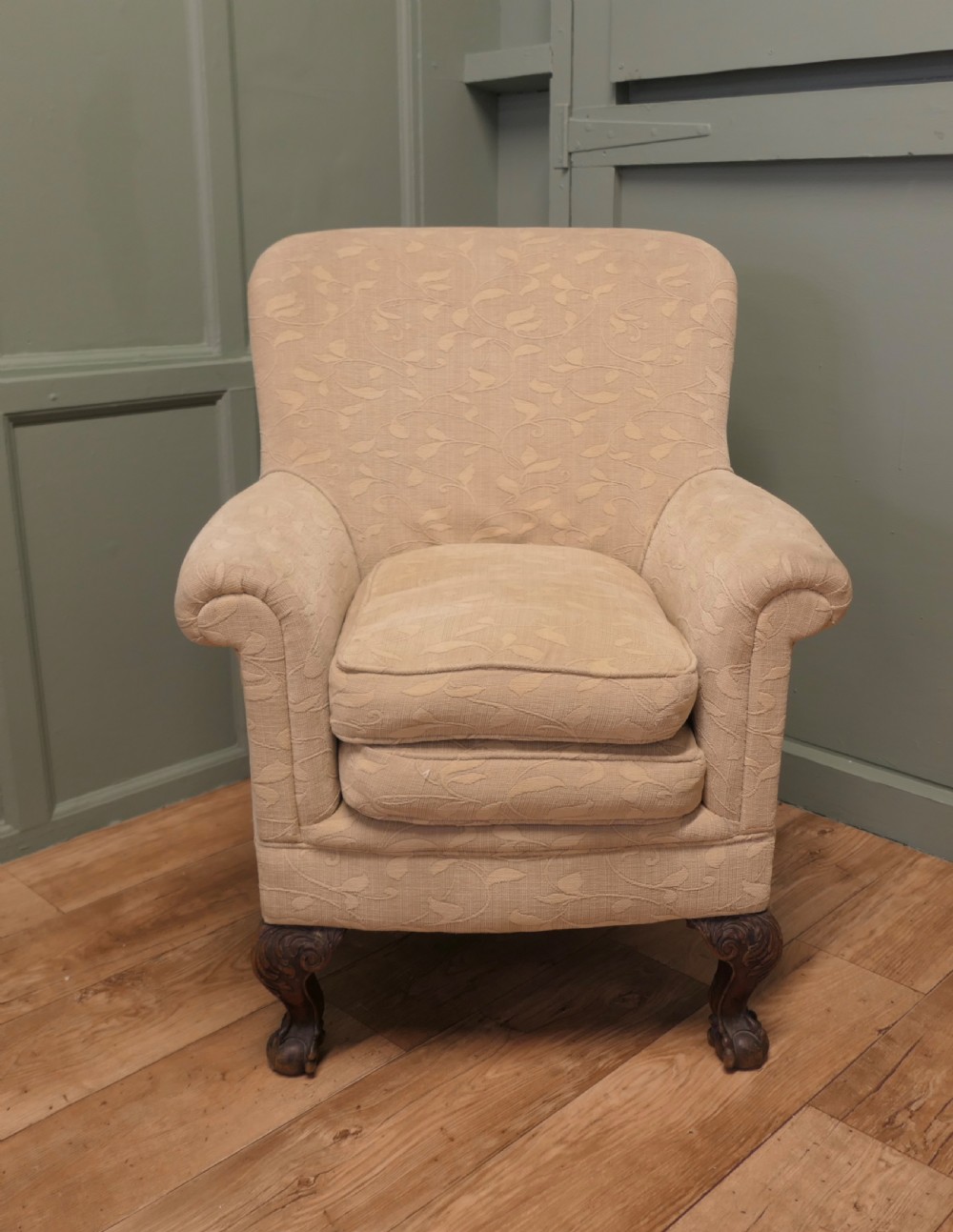 A Victorian upholstered tub armchair in cream patterned fabric with carved timber legs. View II