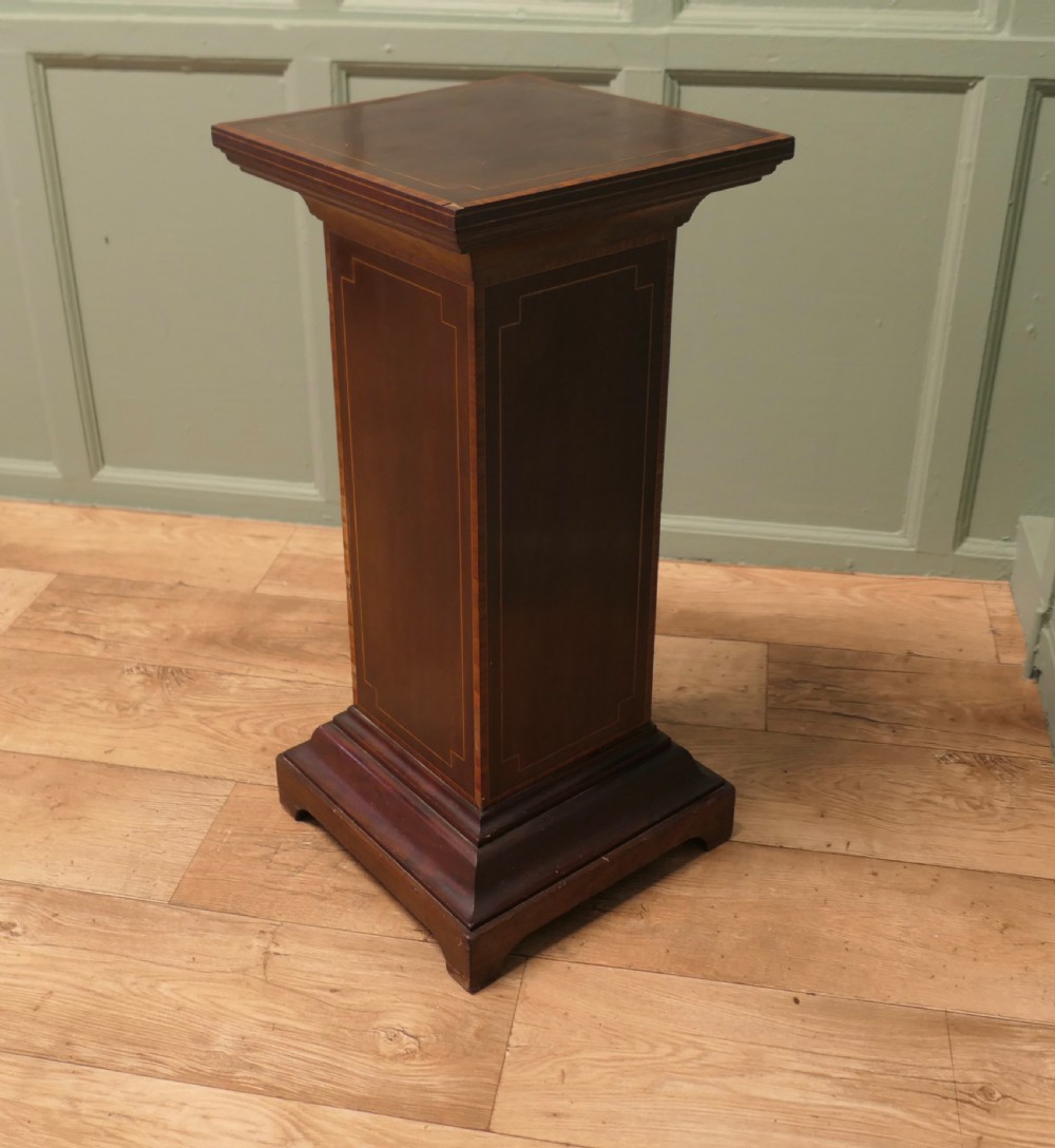 A square-topped 19th-century French wooden display pedestal featuring dark brown timber with subtle geometric string inlay along the central column and stepped base. View V