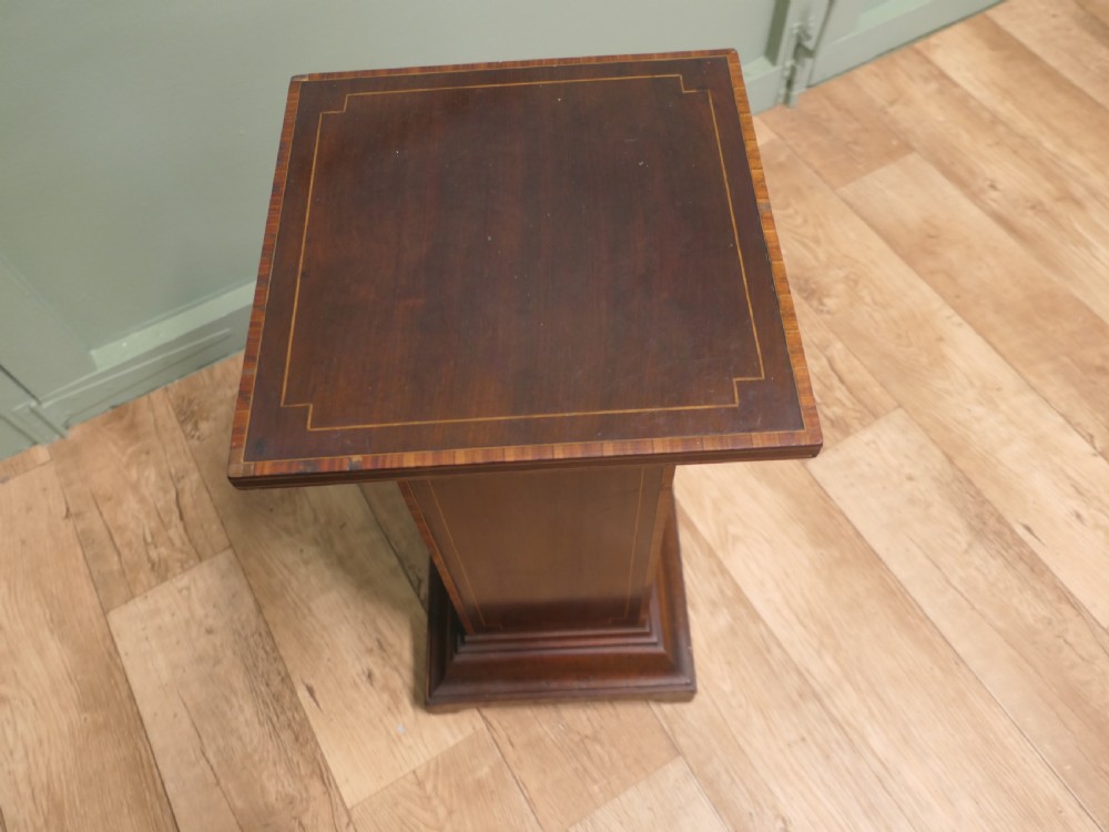 A square-topped 19th-century French wooden display pedestal featuring dark brown timber with subtle geometric string inlay along the central column and stepped base. View VI