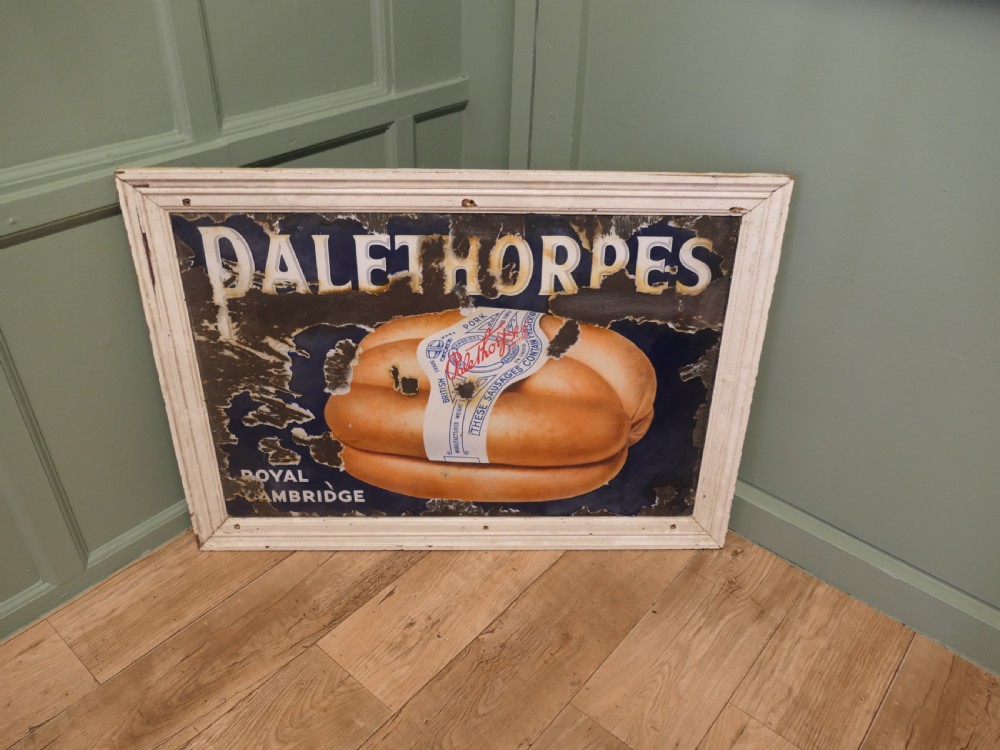 A framed antique blue and white enamel advertising sign for Palethorpes Royal Cambridge sausages featuring a central pictorial illustration. View V
