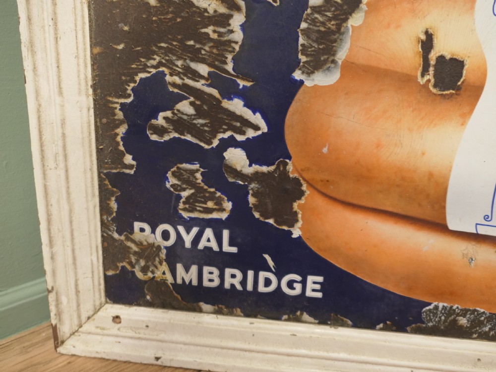 A framed antique blue and white enamel advertising sign for Palethorpes Royal Cambridge sausages featuring a central pictorial illustration. View VI