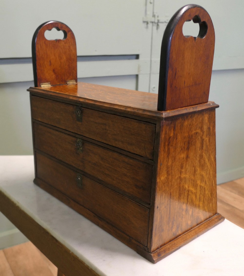 A Victorian mahogany shop counter display cabinet with a gilded reverse-painted glass panel advertising George W. Hughes steel pens. View IV
