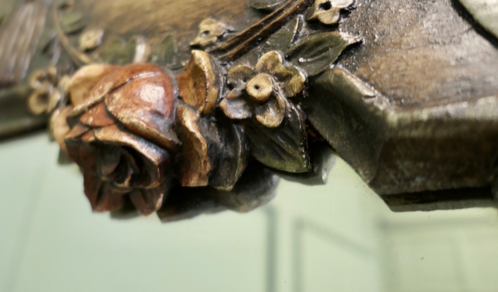 A 19th-century Northern Italian Baroque style wall mirror featuring a carved wooden frame with a scallop shell crest and polychrome floral carvings. View IV