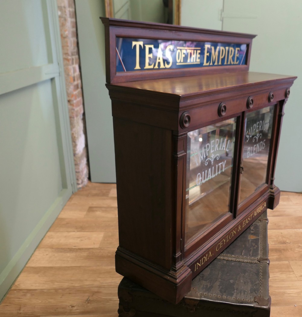 Victorian mahogany shop display cabinet featuring gilded signage reading Teas of the Empire and acid-etched glass doors. View II